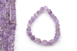 Vedere dettagli per Ametista sfaccettata. Filo da 25/30 mm Immagine di Ametista sfaccettata. Filo da 25/30 mm