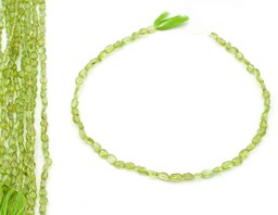 Vedere dettagli per Filo di Peridoto ovale barocco 7x5 mm Immagine di Filo di Peridoto ovale barocco 7x5 mm