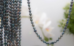 Bild von Süsswasser Perlen Disc  6.5mm Strang (grau)